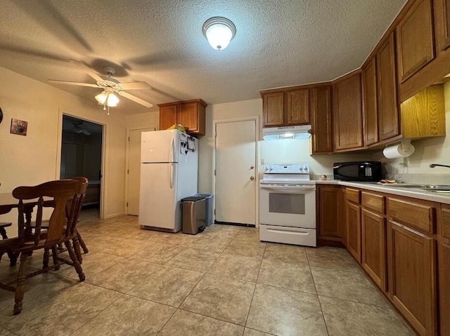 818 Lark St Unit 1, 2, 3, 4, Fort Walton Beach, FL 32547 - kitchen featuring white appliances, under cabinet range hood, brown cabinets, a ceiling fan, and a textured ceiling