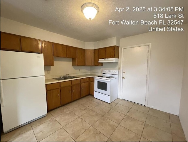 818 Lark St Unit 1, 2, 3, 4, Fort Walton Beach, FL 32547 - kitchen featuring white appliances, under cabinet range hood, light countertops, a textured ceiling, and light tile patterned floors