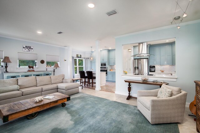 95 Bluebell Cir, Santa Rosa Beach, FL 32459 - living room featuring light tile patterned floors, crown molding, and recessed lighting