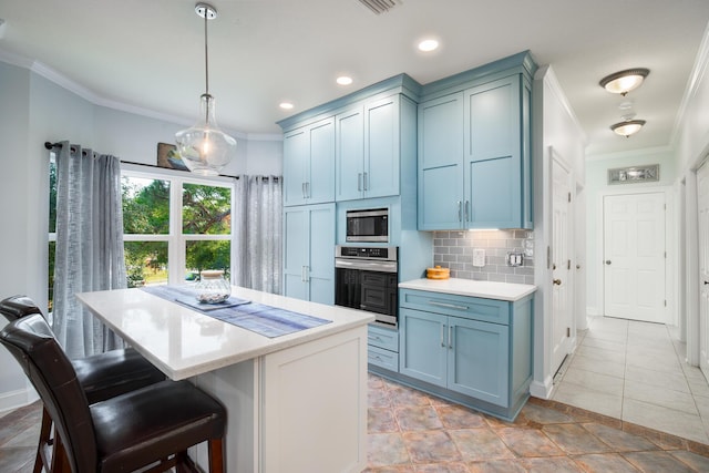 95 Bluebell Cir, Santa Rosa Beach, FL 32459 - kitchen with stainless steel appliances, ornamental molding, light countertops, a kitchen bar, and tasteful backsplash