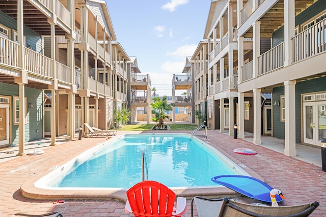 6236 Thomas Dr, Panama City Beach, FL 32408 - community pool featuring a patio area