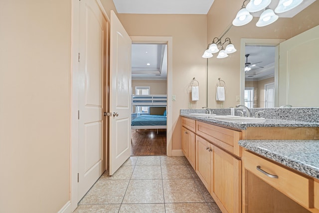 6236 Thomas Dr, Panama City Beach, FL 32408 - bathroom with plenty of natural light, vanity, crown molding, tile patterned floors, and a tray ceiling