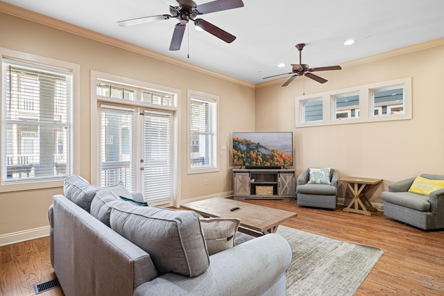 6236 Thomas Dr, Panama City Beach, FL 32408 - living area featuring ornamental molding, a ceiling fan, baseboards, recessed lighting, and wood finished floors