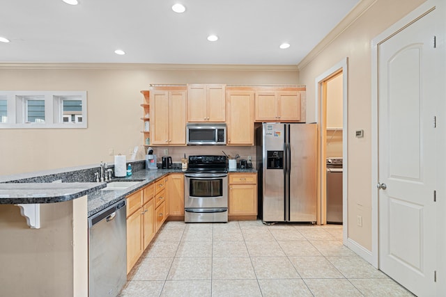 6236 Thomas Dr, Panama City Beach, FL 32408 - kitchen featuring appliances with stainless steel finishes, light brown cabinetry, ornamental molding, a sink, and a peninsula