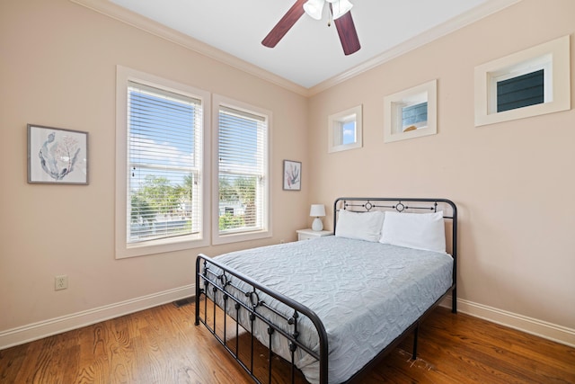 6236 Thomas Dr, Panama City Beach, FL 32408 - bedroom featuring ornamental molding, baseboards, wood finished floors, and ceiling fan