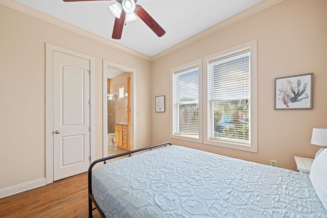 6236 Thomas Dr, Panama City Beach, FL 32408 - bedroom with ornamental molding, light wood-style floors, baseboards, ensuite bathroom, and ceiling fan