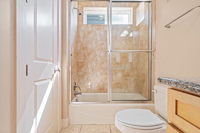 6236 Thomas Dr, Panama City Beach, FL 32408 - full bath featuring combined bath / shower with glass door, toilet, vanity, and tile patterned floors