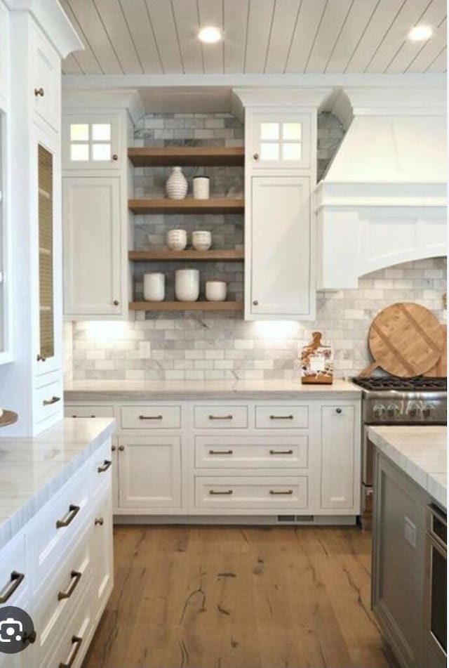 3733 Tiger Point Blvd, Gulf Breeze, FL 32563 - kitchen with wood ceiling, open shelves, white cabinets, and light wood-style floors