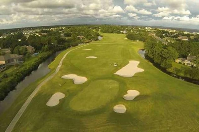 3733 Tiger Point Blvd, Gulf Breeze, FL 32563 - aerial view of a golf course and a nearby body of water