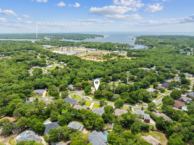2009 Kildare Cir, Niceville, FL 32578 - aerial view of residential area featuring a nearby body of water and a heavily wooded area