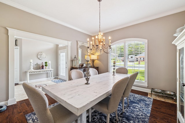 2009 Kildare Cir, Niceville, FL 32578 - dining area with crown molding, a chandelier, baseboards, and dark wood finished floors