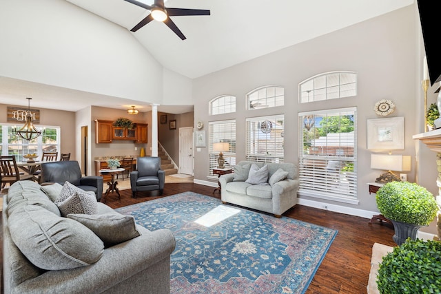 2009 Kildare Cir, Niceville, FL 32578 - living area with high vaulted ceiling, stairway, a ceiling fan, baseboards, and healthy amount of natural light