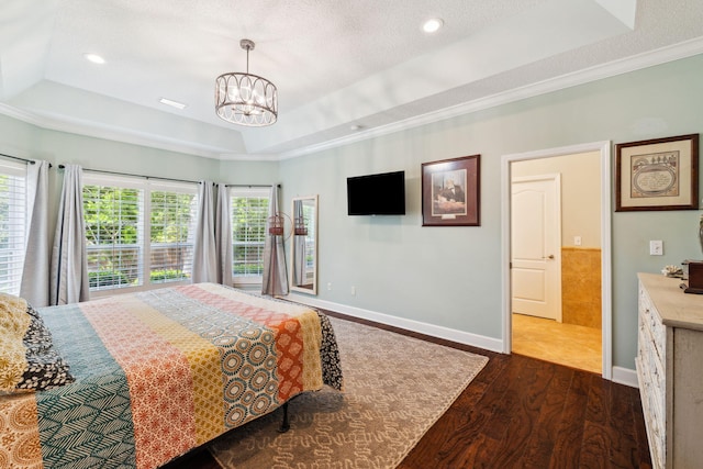 2009 Kildare Cir, Niceville, FL 32578 - bedroom with dark wood finished floors, a tray ceiling, a chandelier, baseboards, and crown molding