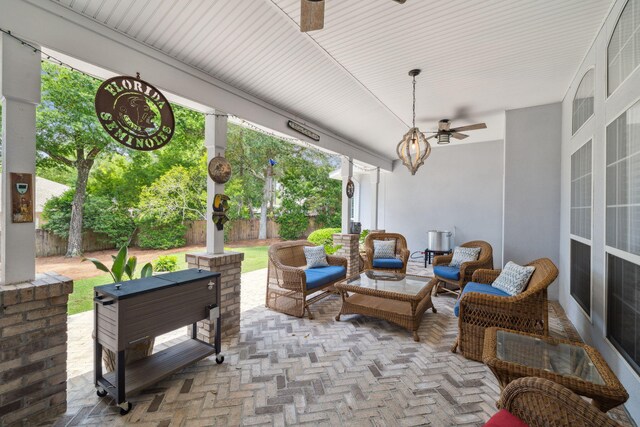 2009 Kildare Cir, Niceville, FL 32578 - fenced backyard with ceiling fan, a patio area, and an outdoor living space