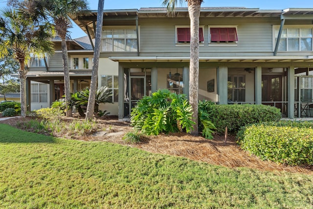8603 Magnolia Bay Ln, Miramar Beach, FL 32550 - rear view of property featuring a sunroom and a yard