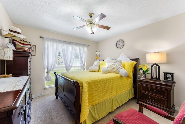 2424 Pineneedle Dr, Navarre, FL 32566 - bedroom featuring multiple windows, carpet floors, a ceiling fan, and a textured ceiling
