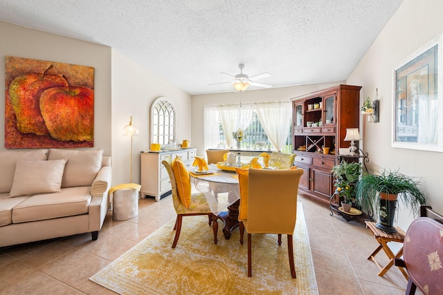 2424 Pineneedle Dr, Navarre, FL 32566 - dining space with light tile patterned floors, a textured ceiling, and ceiling fan