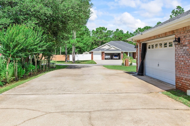2424 Pineneedle Dr, Navarre, FL 32566 - view of concrete driveway