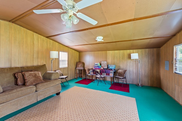 2424 Pineneedle Dr, Navarre, FL 32566 - living area with wooden walls, vaulted ceiling, healthy amount of natural light, and ceiling fan