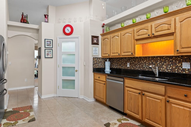 2424 Pineneedle Dr, Navarre, FL 32566 - kitchen with appliances with stainless steel finishes, tasteful backsplash, and light tile patterned flooring
