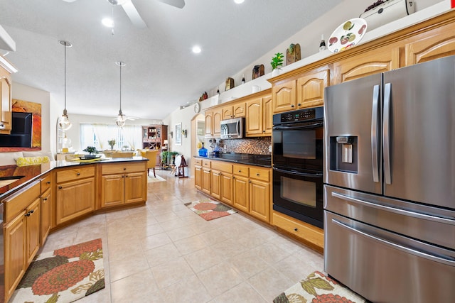 2424 Pineneedle Dr, Navarre, FL 32566 - kitchen with black appliances, ceiling fan, tasteful backsplash, dark countertops, and decorative light fixtures