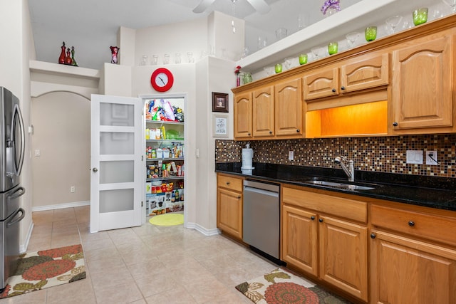 2424 Pineneedle Dr, Navarre, FL 32566 - kitchen with stainless steel appliances, tasteful backsplash, light tile patterned floors, and a ceiling fan