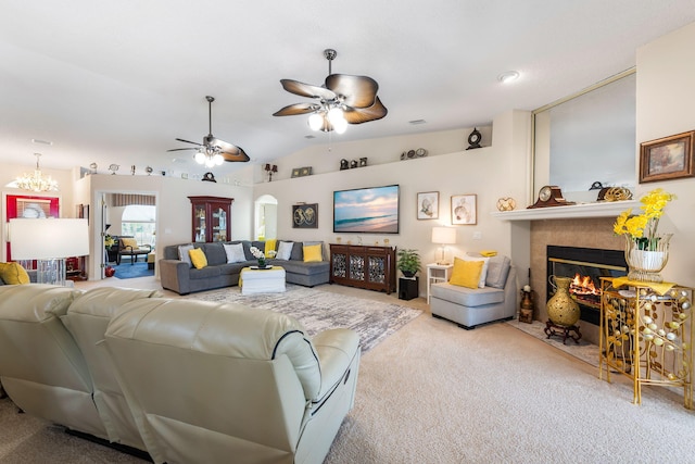 2424 Pineneedle Dr, Navarre, FL 32566 - carpeted living room featuring a tile fireplace, a ceiling fan, lofted ceiling, and a chandelier