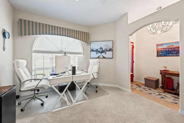2424 Pineneedle Dr, Navarre, FL 32566 - office space with carpet, arched walkways, and a chandelier