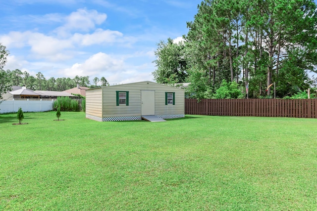 2424 Pineneedle Dr, Navarre, FL 32566 - fenced backyard with an outdoor structure