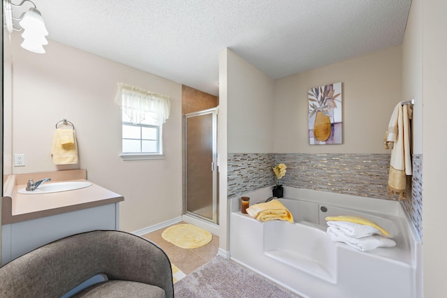 2424 Pineneedle Dr, Navarre, FL 32566 - bathroom featuring a shower stall, a bath, tile patterned floors, vanity, and a textured ceiling