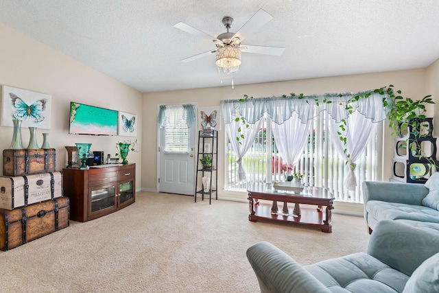 2424 Pineneedle Dr, Navarre, FL 32566 - carpeted living area featuring a textured ceiling and ceiling fan