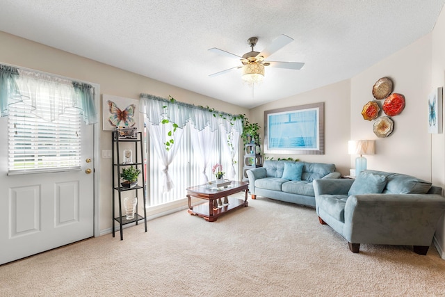 2424 Pineneedle Dr, Navarre, FL 32566 - living room featuring carpet floors, a ceiling fan, and a textured ceiling