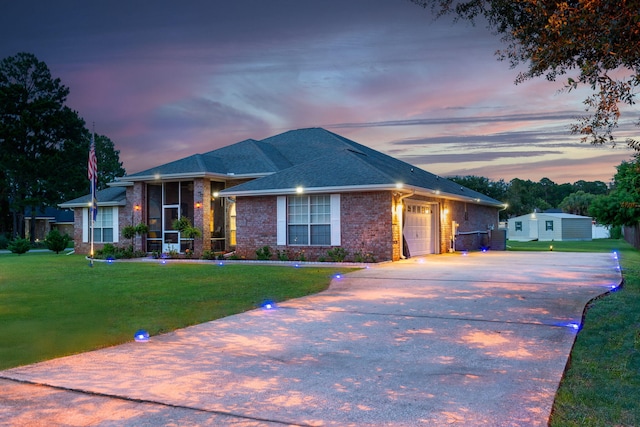 2424 Pineneedle Dr, Navarre, FL 32566 - single story home featuring an attached garage, driveway, brick siding, and a yard