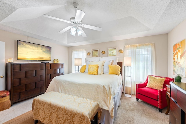 2424 Pineneedle Dr, Navarre, FL 32566 - bedroom with light carpet, ceiling fan, and a textured ceiling