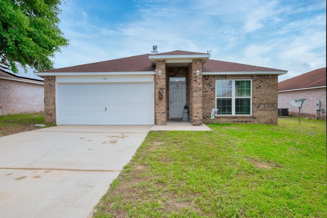 104 Sandstone Trl, Crestview, FL 32539 - single story home with brick siding, concrete driveway, a garage, and a front lawn