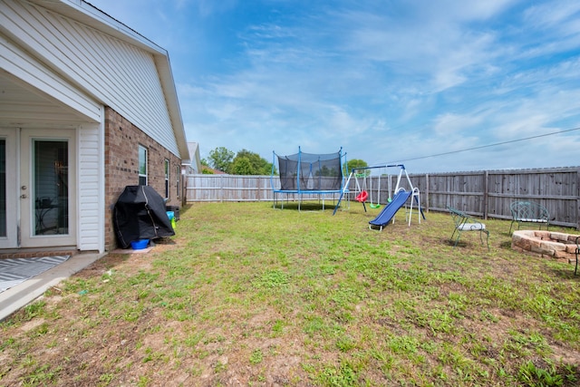 104 Sandstone Trl, Crestview, FL 32539 - view of yard with a trampoline and a playground