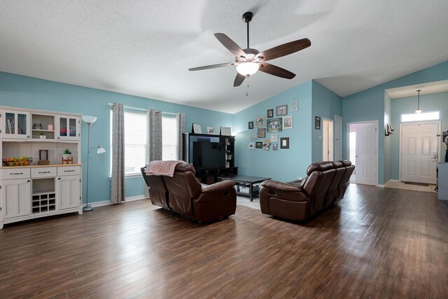 104 Sandstone Trl, Crestview, FL 32539 - living area featuring lofted ceiling, dark wood-type flooring, a textured ceiling, ceiling fan, and baseboards