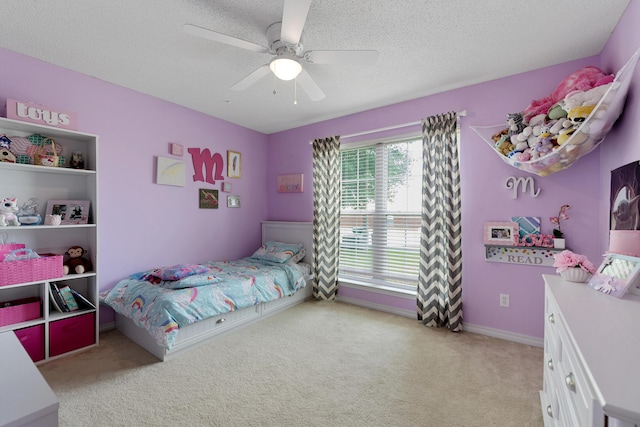 104 Sandstone Trl, Crestview, FL 32539 - bedroom featuring light carpet, a textured ceiling, and a ceiling fan