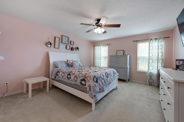 104 Sandstone Trl, Crestview, FL 32539 - bedroom with light colored carpet, a textured ceiling, ceiling fan, and baseboards