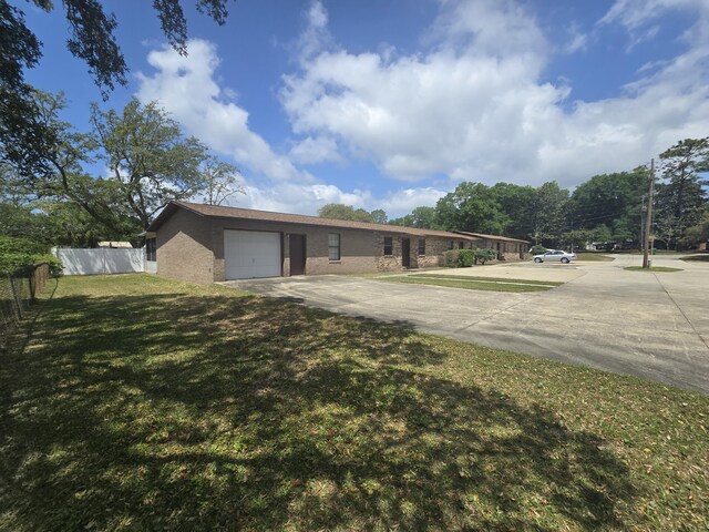 816 Lark St Unit 5, 6, 7, 8, Fort Walton Beach, FL 32547 - view of front of house with driveway, an attached garage, and brick siding