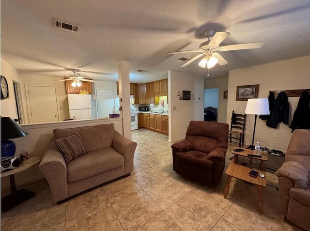 816 Lark St Unit 5, 6, 7, 8, Fort Walton Beach, FL 32547 - living room with ceiling fan, a textured ceiling, and light tile patterned floors