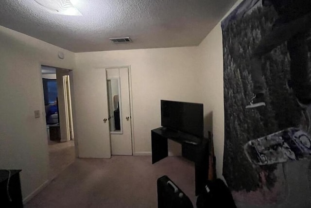 816 Lark St Unit 5, 6, 7, 8, Fort Walton Beach, FL 32547 - carpeted living area with a textured ceiling and baseboards