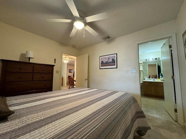 816 Lark St Unit 5, 6, 7, 8, Fort Walton Beach, FL 32547 - bedroom featuring a textured ceiling, connected bathroom, a ceiling fan, and light carpet
