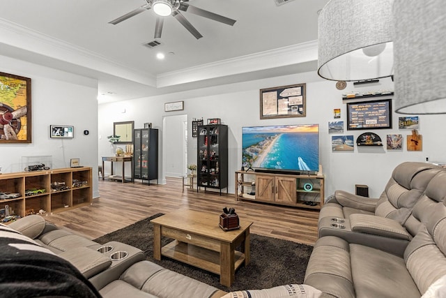 736 Commanche St, Fort Walton Beach, FL 32547 - living area featuring wood finished floors, a ceiling fan, crown molding, a raised ceiling, and baseboards