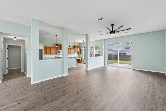 3167 Border Creek Dr, Crestview, FL 32539 - unfurnished living room featuring a ceiling fan, dark wood-style flooring, and baseboards
