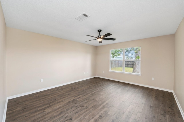 3167 Border Creek Dr, Crestview, FL 32539 - spare room with dark wood finished floors, baseboards, and a ceiling fan