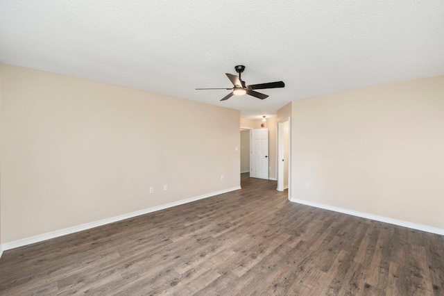 3167 Border Creek Dr, Crestview, FL 32539 - spare room featuring a ceiling fan, dark wood finished floors, and baseboards