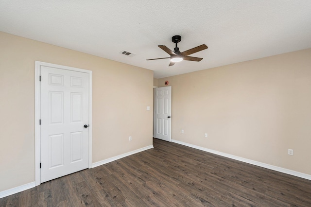 3167 Border Creek Dr, Crestview, FL 32539 - unfurnished bedroom featuring dark wood finished floors, baseboards, and a ceiling fan