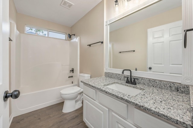 3167 Border Creek Dr, Crestview, FL 32539 - full bathroom featuring toilet, vanity, wood finished floors, and  shower combination