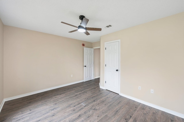 3167 Border Creek Dr, Crestview, FL 32539 - unfurnished bedroom featuring wood finished floors, baseboards, and ceiling fan